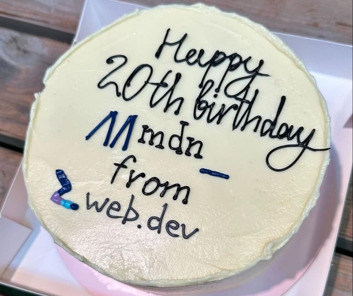A birthday cake decorated with the words 'Happy 20th birthday MDN, from web.dev'